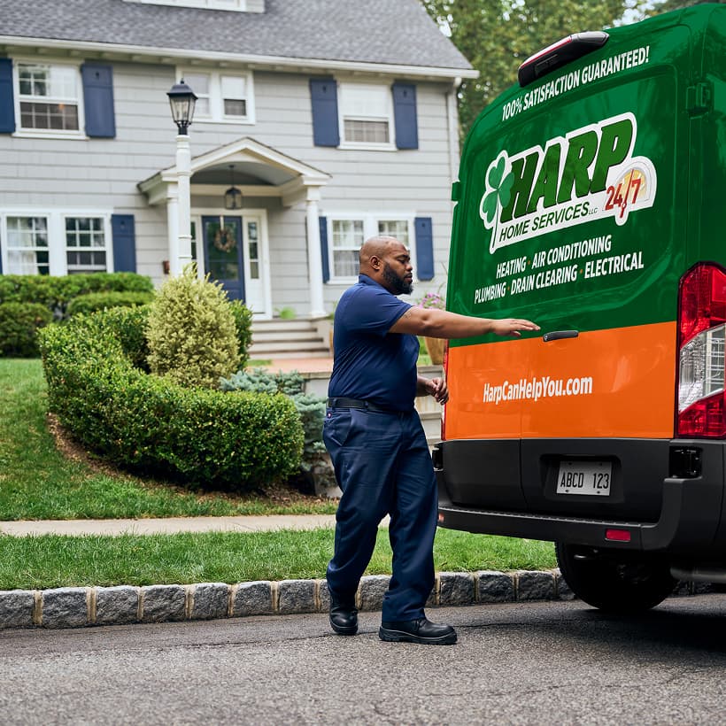 A Harp technician arrives at a home ready to provide expert HVAC, plumbing, and electrical services.