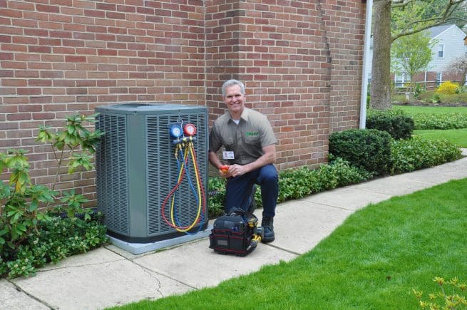 HARP technician inspecting a HVAC unit