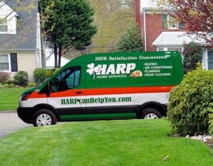 HARP Home Services van outside a residential home